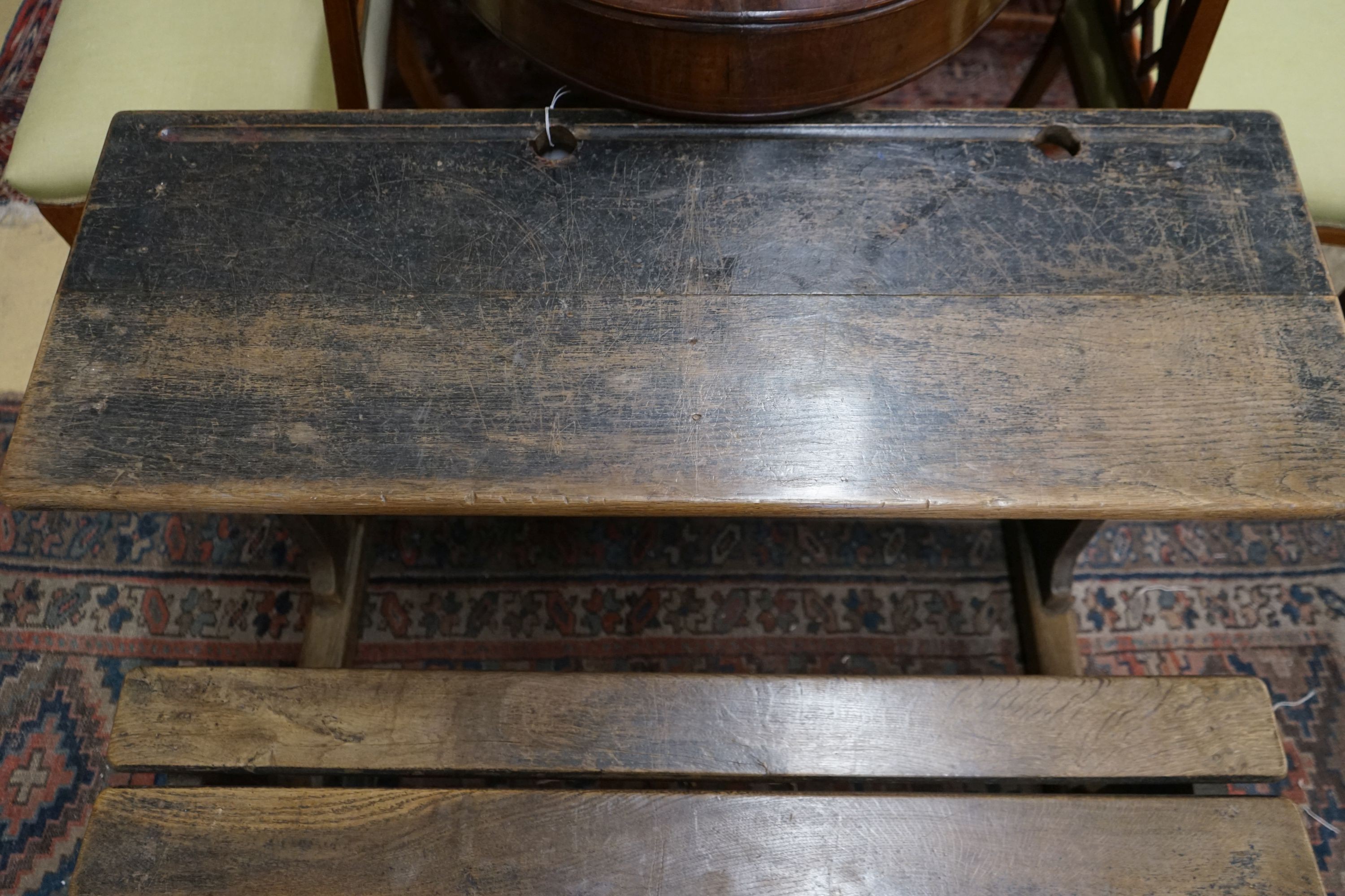 A vintage oak double student's desk, width 105cm, depth 65cm, height 67cm